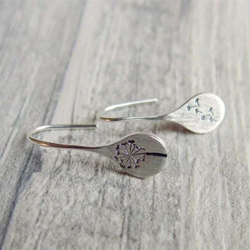 Boucles d'oreilles exclusives en argent avec feuilles de dent de lion