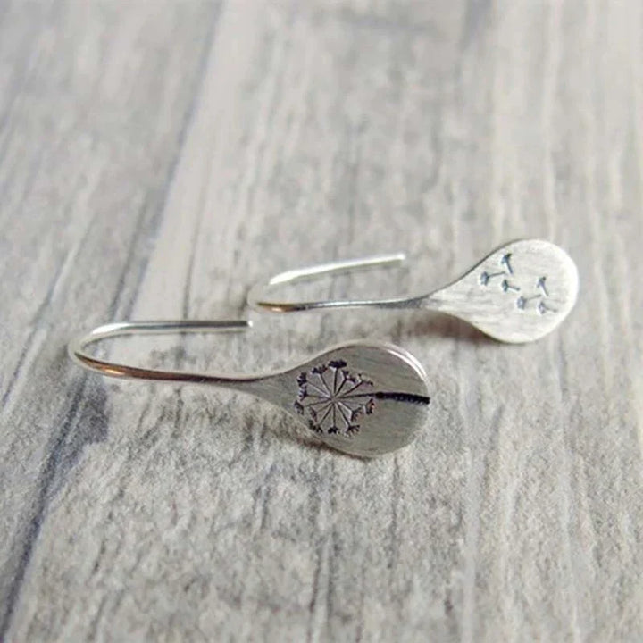 Boucles d'oreilles exclusives en argent avec feuilles de dent de lion